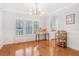 Bright dining room with hardwood floors, wainscotting, and stylish light fixture, perfect for gatherings at 1862 Lake Ebenezer Trl, Marietta, GA 30066
