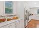 Bright, modern kitchen with white cabinetry, stainless steel appliances, and quartz countertops, ideal for culinary enthusiasts at 1862 Lake Ebenezer Trl, Marietta, GA 30066