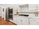 Kitchen showcases stainless steel appliances, white cabinetry, and modern backsplash at 1862 Lake Ebenezer Trl, Marietta, GA 30066