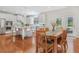 Open-concept kitchen and dining area with stainless appliances, large island and hardwood flooring at 1862 Lake Ebenezer Trl, Marietta, GA 30066