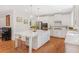 Bright kitchen featuring white cabinets, stainless steel appliances, and a large center island with seating at 1862 Lake Ebenezer Trl, Marietta, GA 30066