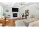 Cozy living room featuring a fireplace, coffered ceiling, and ample natural light at 1862 Lake Ebenezer Trl, Marietta, GA 30066