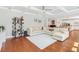 Spacious living room with hardwood floors, large sectional sofa, and open access to the kitchen at 1862 Lake Ebenezer Trl, Marietta, GA 30066