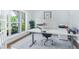 Bright and airy office space with a large window, modern desk setup, and elegant rug at 1862 Lake Ebenezer Trl, Marietta, GA 30066