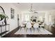 Elegant dining area featuring a modern table, stylish seating, and seamless flow into the adjacent living space at 2813 White Oak Ln, Decatur, GA 30032
