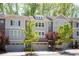 View of townhomes featuring a combination of brick, siding, and stone elements at 2813 White Oak Ln, Decatur, GA 30032