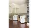 Second floor sitting area with hardwood floors, two chairs, and a chalkboard wall at 2813 White Oak Ln, Decatur, GA 30032