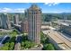 Stunning aerial view of high-rise building with city skyline in the background at 3475 Oak Valley Rd # Apt 650, Atlanta, GA 30326