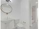 Bathroom features a pedestal sink, toilet, and tile floors at 3475 Oak Valley Rd # Apt 650, Atlanta, GA 30326