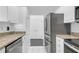 A view of the kitchen with stainless steel appliances and white cabinets at 3475 Oak Valley Rd # Apt 650, Atlanta, GA 30326