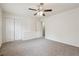 This bedroom offers a ceiling fan, neutral carpet, and a closet at 4282 Worth Nw St, Acworth, GA 30101