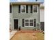 Charming townhouse with green siding, black shutters, and well-maintained front yard at 4282 Worth Nw St, Acworth, GA 30101