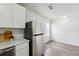 The eat-in kitchen features stainless steel appliances and wood-look laminate flooring at 4282 Worth Nw St, Acworth, GA 30101