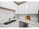 Bright kitchen features stainless steel appliances, white cabinets and subway tile backsplash at 4282 Worth Nw St, Acworth, GA 30101