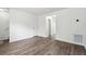 Spacious living room with wood-look flooring and ample natural light at 4282 Worth Nw St, Acworth, GA 30101