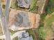 An aerial view showing the roof line and yard of a large home in a suburban neighborhood at 5694 Brendlynn Dr, Suwanee, GA 30024
