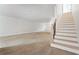 Unfinished basement with stairs offers a blank canvas for customization and future expansion at 5694 Brendlynn Dr, Suwanee, GA 30024