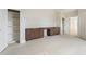 Bright and spacious bonus room featuring walk in closet and custom cabinets, perfect for versatile use and storage at 5694 Brendlynn Dr, Suwanee, GA 30024