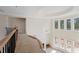 Bright foyer features a high ceiling, large windows, and an open design leading to other parts of the home at 5694 Brendlynn Dr, Suwanee, GA 30024