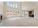 Bright open living area featuring large windows, lots of natural light and a fireplace at 5694 Brendlynn Dr, Suwanee, GA 30024