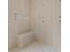 Modern tiled shower featuring a built-in bench and convenient niche at 5694 Brendlynn Dr, Suwanee, GA 30024