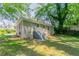 Backyard with grassy area and staircase leading to back entry door at 2041 W Flat Shoals Ter, Decatur, GA 30034