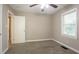 Bedroom with neutral paint, carpeted floor, a window, and closet access at 2041 W Flat Shoals Ter, Decatur, GA 30034