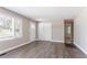 Inviting living room featuring wood-look flooring, neutral-colored walls, and a closet for storage at 2041 W Flat Shoals Ter, Decatur, GA 30034