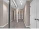 Long hallway with multiple doors and large mirrored closet offers ample storage at 3475 Oak Valley Rd # 660, Atlanta, GA 30326