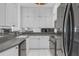 Modern kitchen with stainless steel appliances, white cabinets, and sleek countertops at 3475 Oak Valley Rd # 660, Atlanta, GA 30326