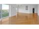 Bright living room with hardwood floors and large windows offering neighborhood views at 3475 Oak Valley Rd # 660, Atlanta, GA 30326
