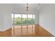 Bright living room with hardwood floors and large windows offering ample natural light and neighborhood views at 3475 Oak Valley Rd # 660, Atlanta, GA 30326