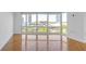 Bright living room with hardwood floors and large windows offering ample natural light and city views at 3475 Oak Valley Rd # 660, Atlanta, GA 30326