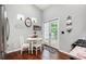 Kitchen breakfast nook with white table and chairs, stainless steel refrigerator, and French doors that lead to the backyard at 624 Spanish Oak Dr, Acworth, GA 30102