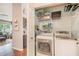 Laundry area with washer and dryer and wire shelving for storage and organization at 624 Spanish Oak Dr, Acworth, GA 30102