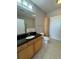 Bathroom with granite countertop and wood cabinet at 799 Hammond Dr # 321, Atlanta, GA 30328