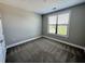 Bedroom features plush carpet and a window at 799 Hammond Dr # 321, Atlanta, GA 30328
