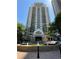 Exterior shot of a high-rise building with fountain and covered entry at 799 Hammond Dr # 321, Atlanta, GA 30328