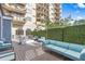 Community area with a fire pit, sofa and lounge seating in a beautiful landscaped setting at 799 Hammond Dr # 321, Atlanta, GA 30328