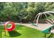 Community dog park with agility equipment, benches and artificial turf at 799 Hammond Dr # 321, Atlanta, GA 30328