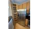 Kitchen with stainless steel refrigerator, pantry, and granite counters at 799 Hammond Dr # 321, Atlanta, GA 30328
