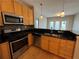 Modern kitchen with stainless steel appliances and black granite countertops at 799 Hammond Dr # 321, Atlanta, GA 30328