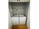 Laundry room featuring a full size washer and dryer with wire shelf at 799 Hammond Dr # 321, Atlanta, GA 30328