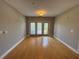 Spacious living room with hardwood floors and a private balcony at 799 Hammond Dr # 321, Atlanta, GA 30328