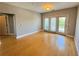 Bright living room with hardwood floors and balcony access at 799 Hammond Dr # 321, Atlanta, GA 30328