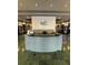 A sleek reception desk stands on a marble floor in a well-lit lobby at 799 Hammond Dr # 321, Atlanta, GA 30328