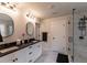 Modern bathroom boasting double vanities, a glass-enclosed shower, and sleek fixtures at 842 Bridgewater Sw St, Atlanta, GA 30310