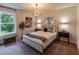 Inviting bedroom with elegant furnishings, accent lighting, and a serene view from the window at 842 Bridgewater Sw St, Atlanta, GA 30310
