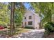 Inviting two-story home with white siding, dark trim, and a long driveway at 842 Bridgewater Sw St, Atlanta, GA 30310