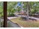 View of front yard showcasing greenery, street, and neighborhood at 842 Bridgewater Sw St, Atlanta, GA 30310